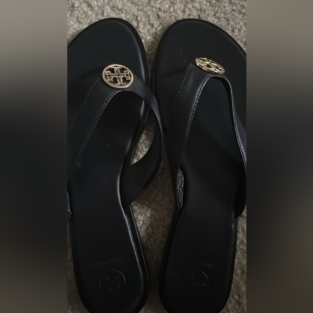Tory Burch Black Flip Flops with Gold Emblem